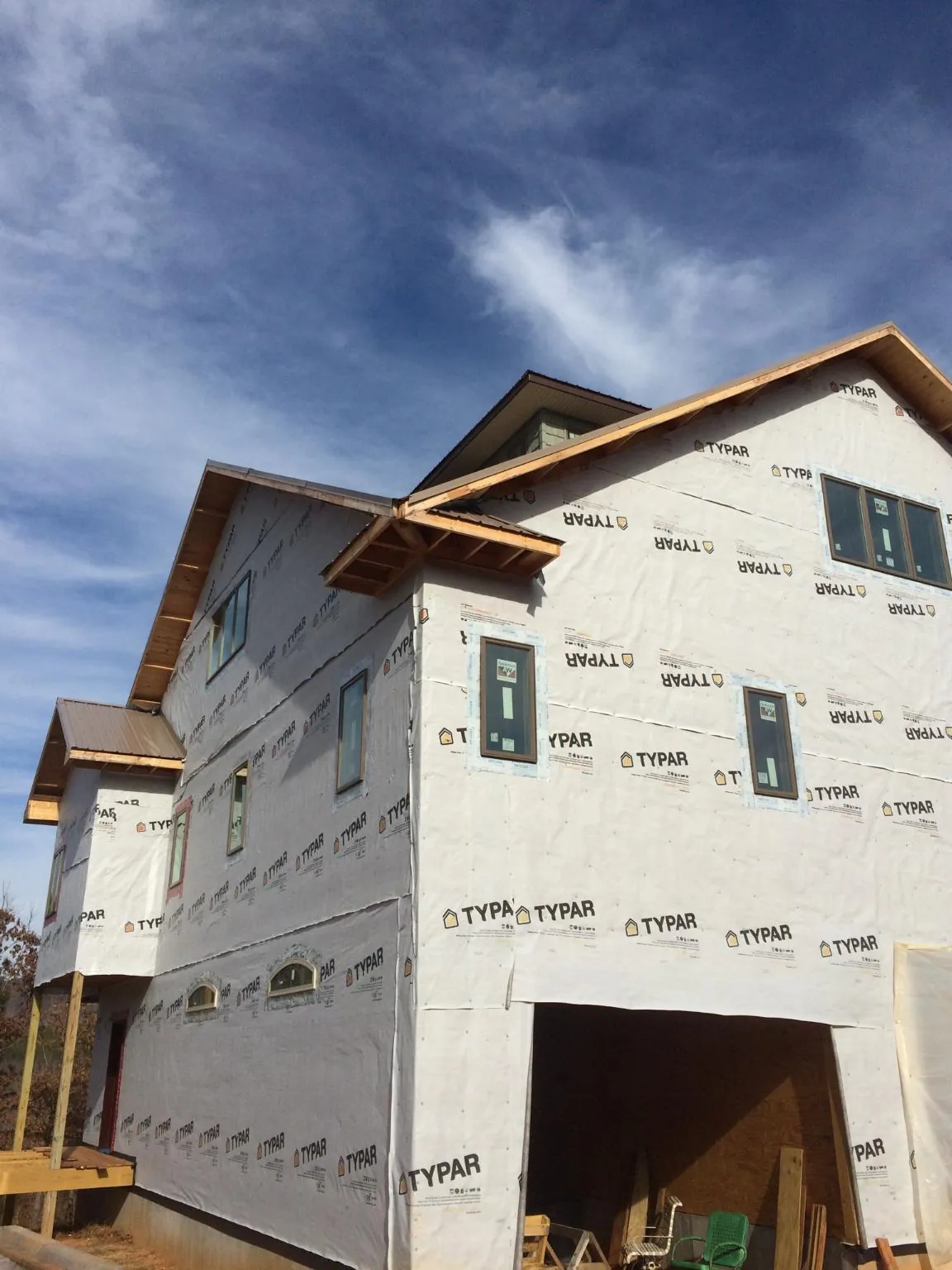 Stick built house wrapped in Typar with new roof framing and dormers in Odessa